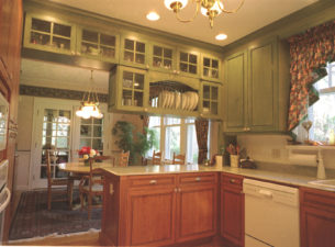 Both Cherry and Maple were utilized in this kitchen remodel project. The finishes were custom mixed for this Kitchen. The apple green was done with a wipe on stain and glaze.