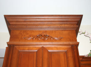 This frieze molding is made by combining astragal molding with a reed and ribbon molding used as a sub crown molding. 4" crown finishes off the very top of this elegant molding detail