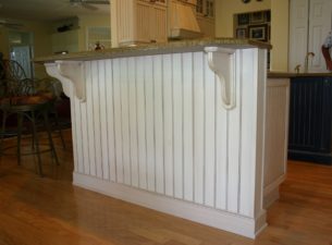 We manufacture this beadboard paneling @ Dixie Workshop. MDF panels are laminated with wood veneer and then milled to create the beading. Beading can be set any width, 3 1/2" on center is shown here. Shop made corbels and baseboard finish the job.
