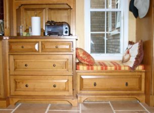 Cabinet to the left is full inset drawers with beaded openings. The Bench Seat to the right was done with a full overlay frameless construction method and the furnture base was added. This made for a larger drawer in the bench seat.