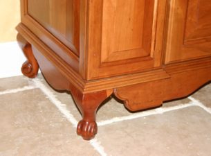 This is the bottom of the large cherry armoire/ panty cabinet that is shown in the furniture section. Here we placed Queen Anne type legs and fitted another ledger skirt between them. Double click on the picture and zoom in.